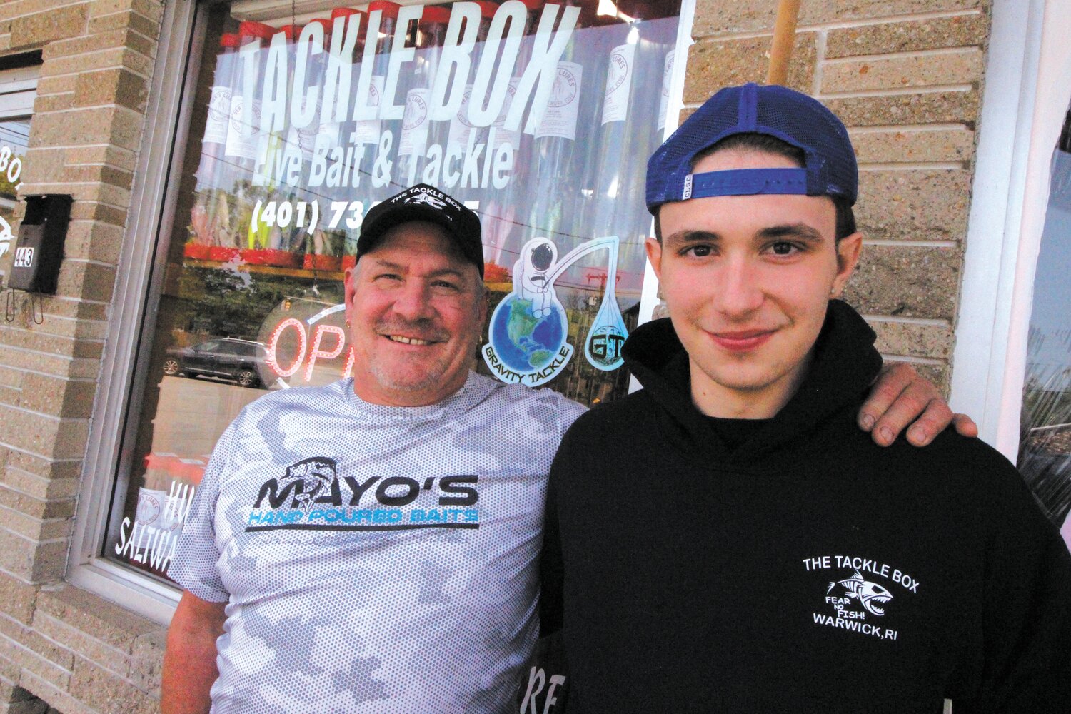 LIFE FATHER, LIKE SON: Tom Giddings, who has run the Tackle Box for the last eight years, is delighted to share the keys to the business with his son, TJ. (Warwick Beacon photo)